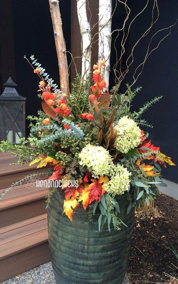 autumn container on front porch made with Hydrangeas, Eucalyptus