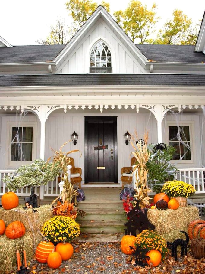 pumpkins, mums, straw bales as beautiful fall outdoor decorations for front porch and door, or add a few Halloween decor pieces 